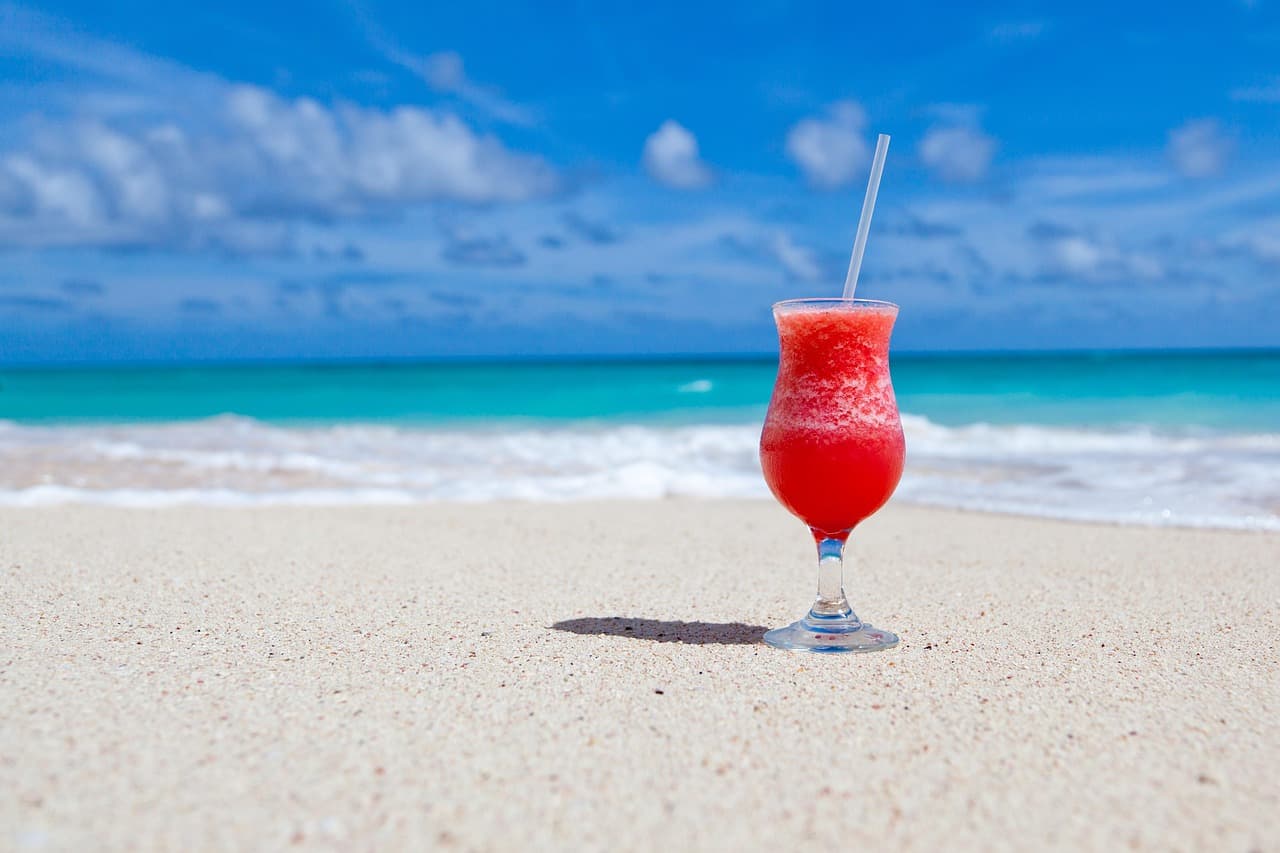 Tropical rum punch cocktail on a Caribbean beach